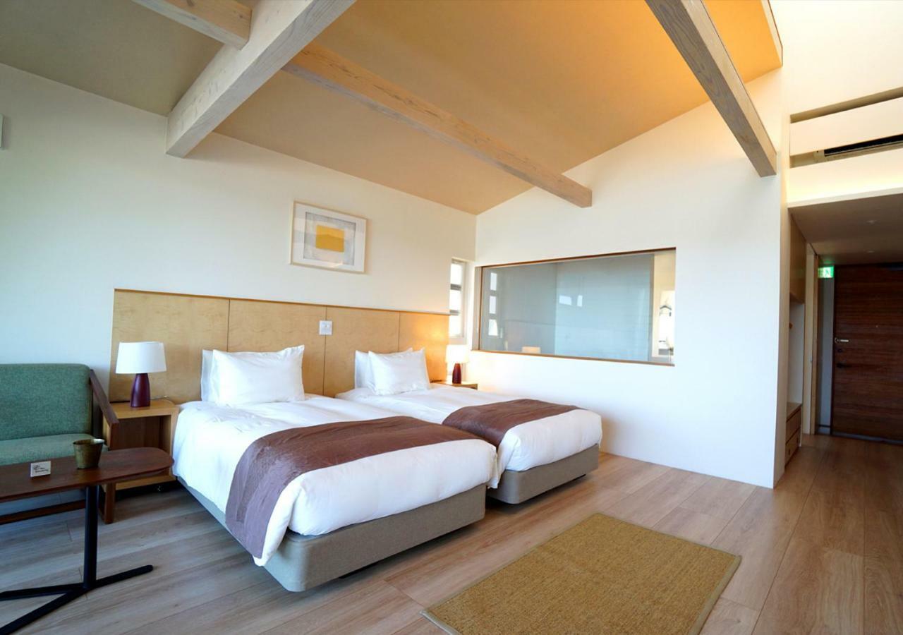 Miru Amami Hotel Tatsugo Bagian luar foto